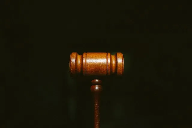 Land Transactions and Conveyancing - Wooden Hammer Symbolizing Secure Property Deals | Justitia Law Advocates, Kampala, Uganda.